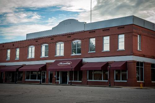 Picture of First National Bank original and current main office.