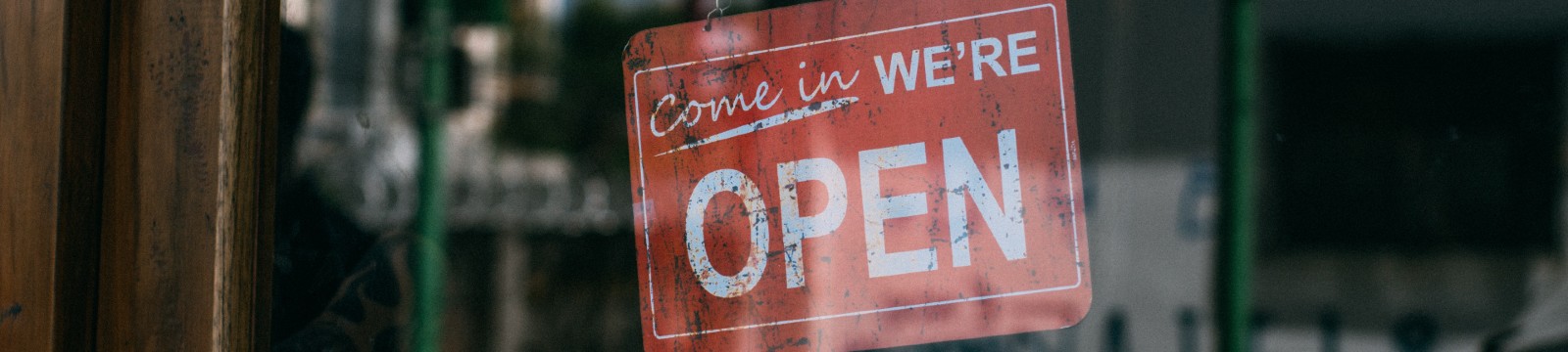 Stock photo of open sign on business door.