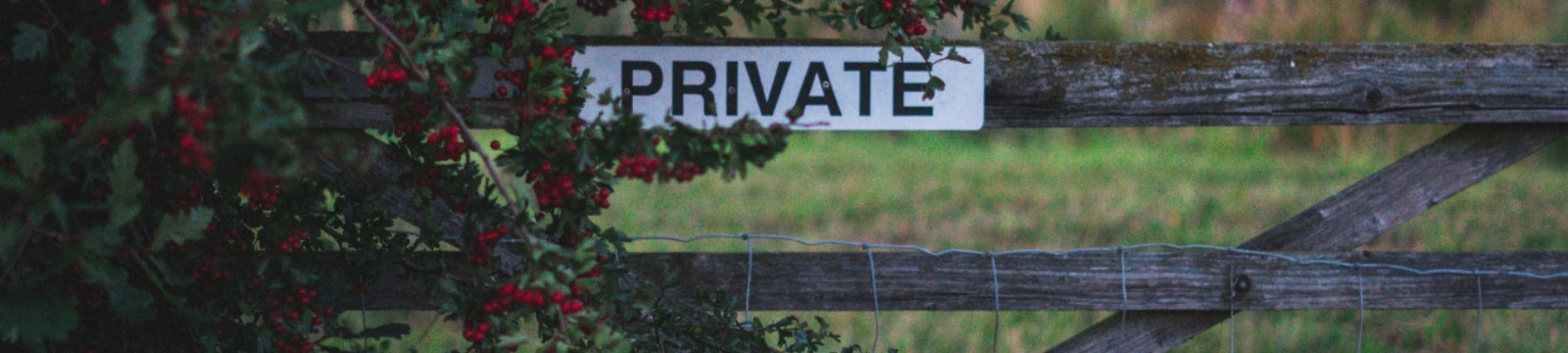 Stock photo of a private sign on old fence