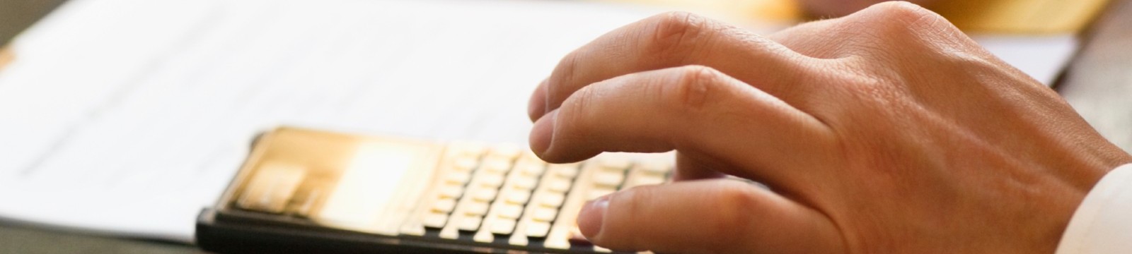 stock image of a man using a calculator